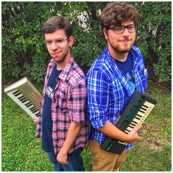 Karl and Will standing with their keyboards